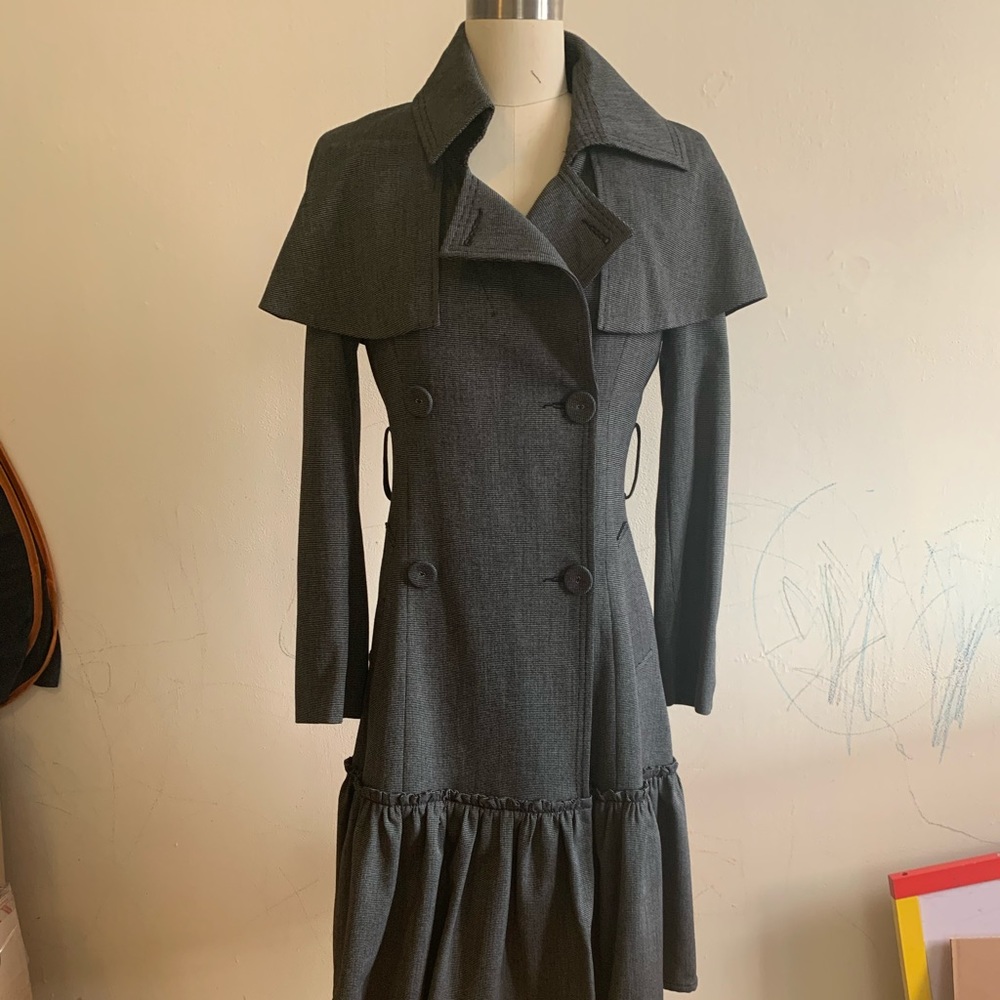 Light trench coat with ruffle bottom